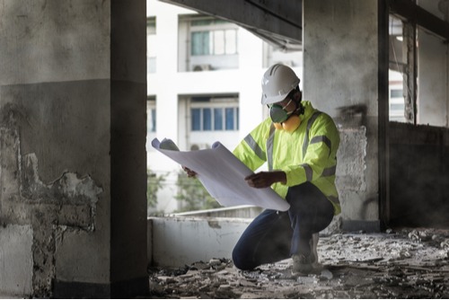 a commercial demolition expert planning the job site