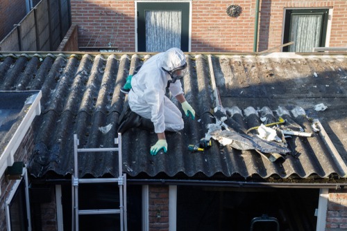 man removes asbestos