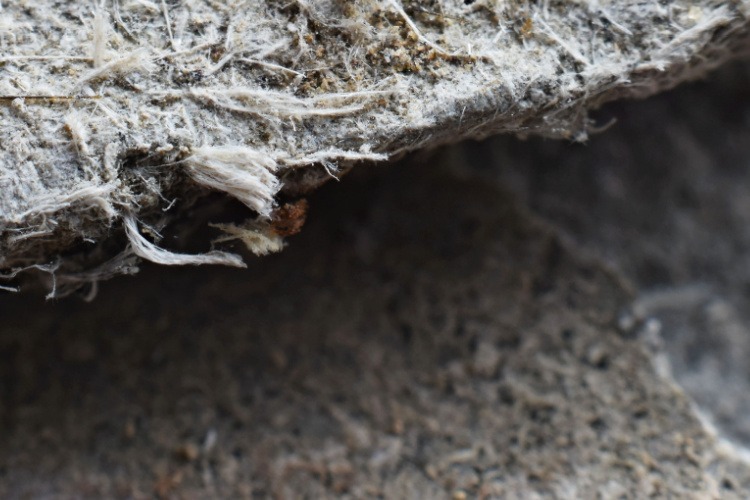 Close up image of asbestos on surface